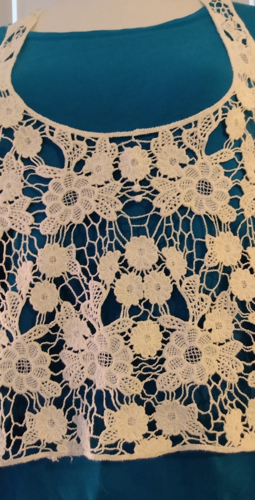 Crocheted off-white top.